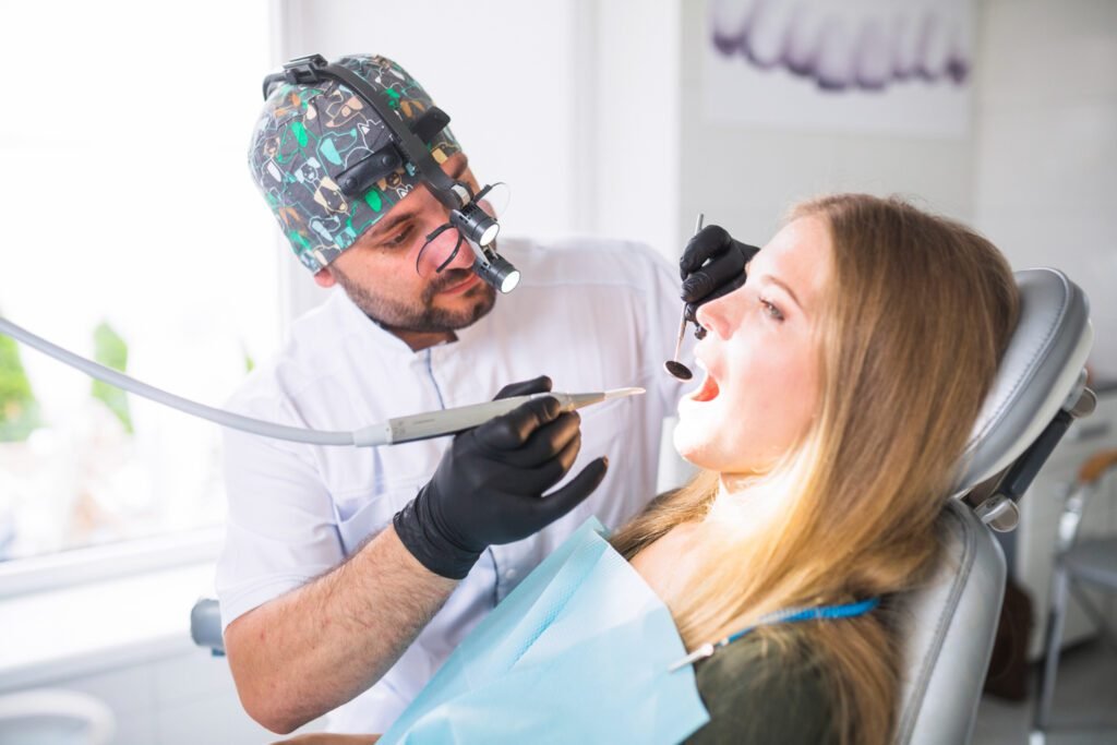 dentist doing dental treatment female Dental Tourism patient