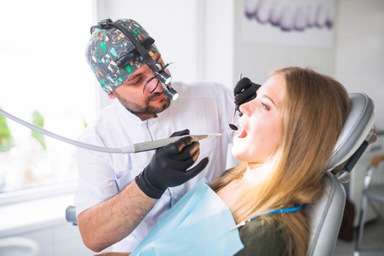 dentist doing dental implants treatment female Dental Tourism patient