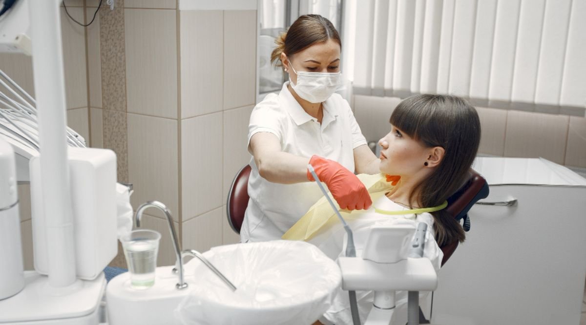 Dental Hygienist Examining a Patient's Oral Health