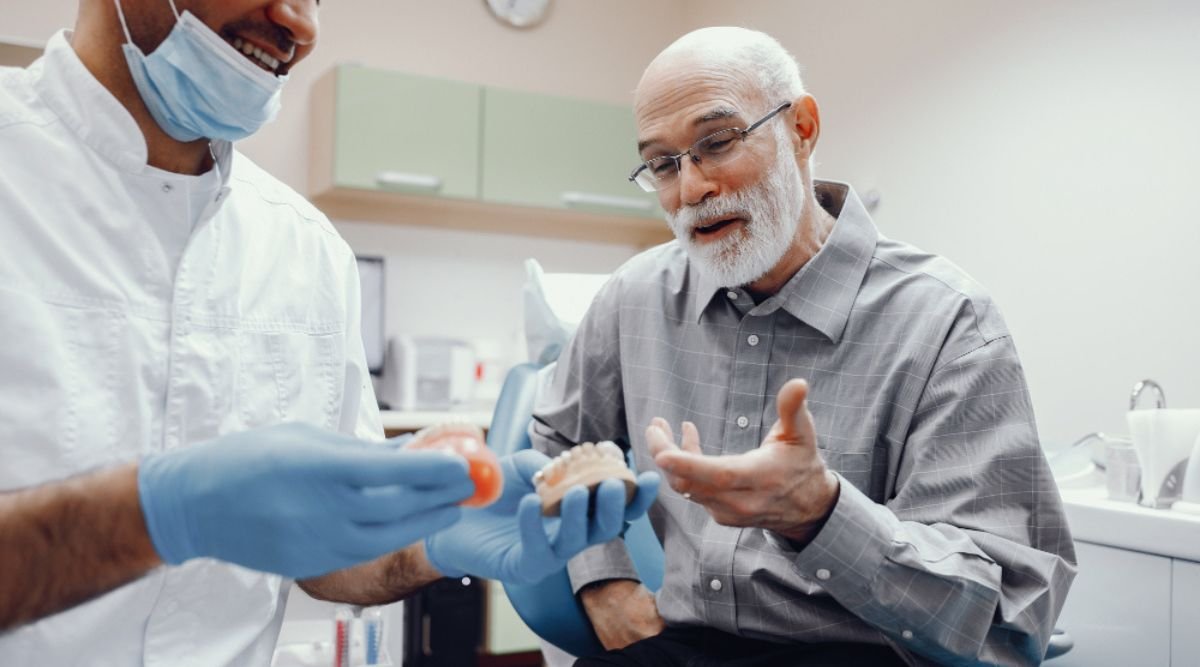 Patient learning about temporary vs. permanent dental implants options at City Dental Hospital